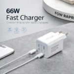 66W fast charger on a gray surface with two USB cables plugged in, and a smartphone nearby.