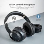 Black wireless over-ear headphones featuring Bluetooth connectivity with cushioned ear pads, positioned on a gray surface.